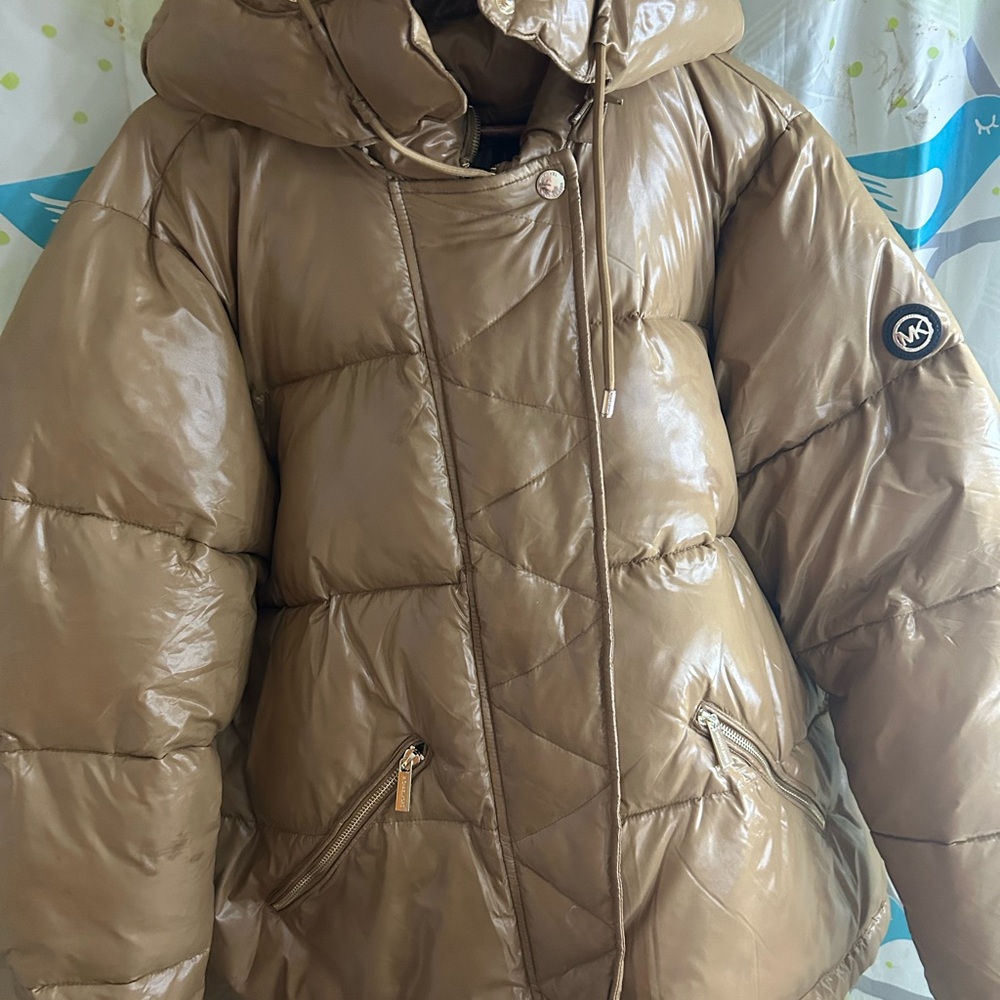 Like new Michael Kors puffer jacket metallic-like tan color.  Size XXL.